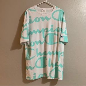 Men’s White Chamipion Heritage Athletic Apparel With Turquoise Blue Lettering